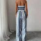 👗 50% OFF NOW! 💥 Geometric Jumpsuit with Halter Neckline & Side Slit – Unique print & elastic back – Versatile, perfect for summer parties or resort wear ✨