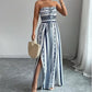 👗 50% OFF NOW! 💥 Geometric Jumpsuit with Halter Neckline & Side Slit – Unique print & elastic back – Versatile, perfect for summer parties or resort wear ✨