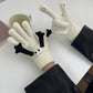 Hand holding gloves warm winter magnetic gloves