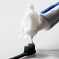 The Thinker Pooping Toothpaste Cap